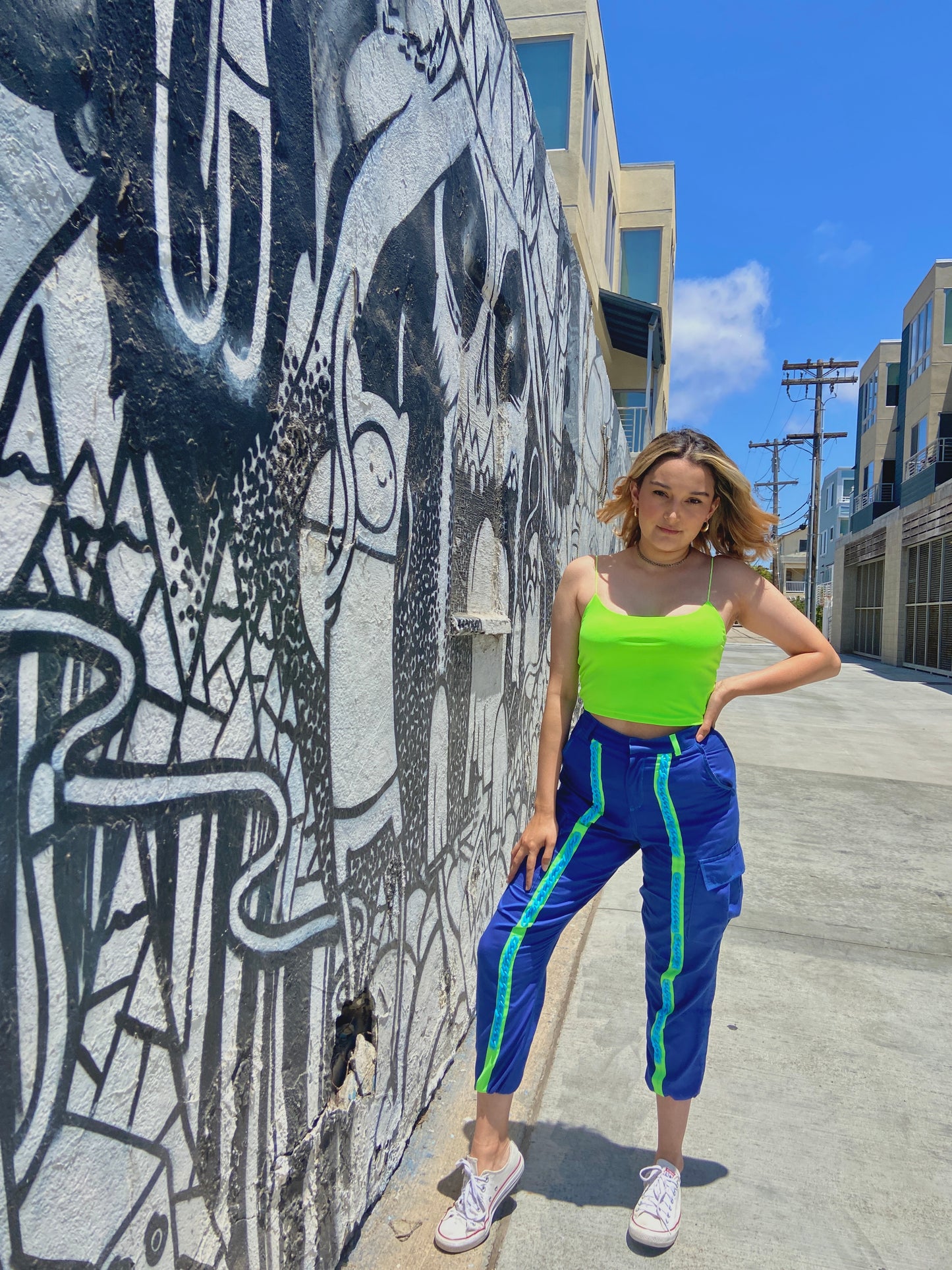 Dark blue cargo pants with neon green straps